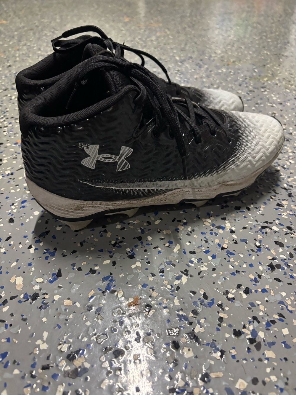 Under Armour Men’s Black and White Mid-Top Cleats